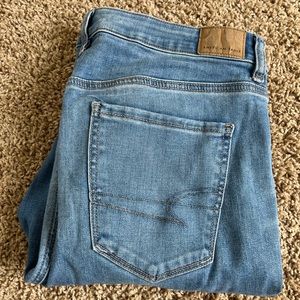 Light wash ripped hem American Eagle 14L jeans
